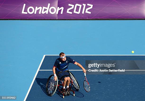 Andy Lapthorne of Great Britain in action during his Quad Doubles Wheelchair Tennis semifinal's match against Mitsuteru Moroishi and Shota Kawano of...