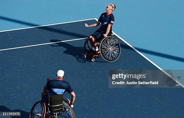 Andy Lapthorne and Peter Norfolk of Great Britain celebrate winning their Quad Doubles Wheelchair Tennis semifinal's match against Mitsuteru Moroishi...