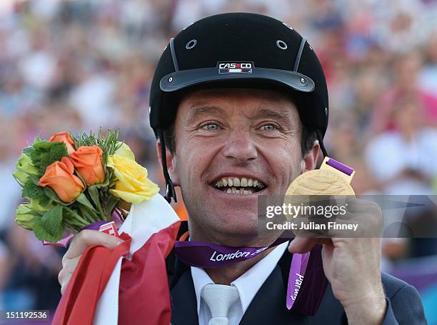 Pepo Puch of Austria with his gold medal after the Men's Dressage Individual Freestyle Test, Grade Ib in the Equestrian on day 5 of the London 2012...