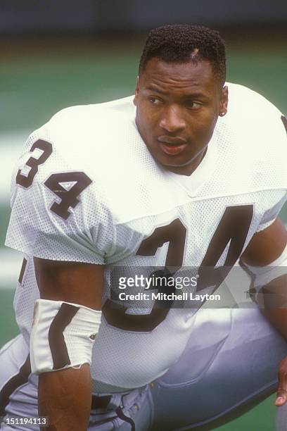 Bo Jackson of the Los Angeles Raiders looks on before a football game against the Phiadelphia Eagles on October 22, 1989 at Veterans Stadium in...