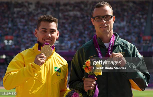 Gold medalist Alan Fonteles Cardoso Oliveira and Silver medalist Oscar Pistorius of South Africa during the medal ceremony on Day 5 of the London...