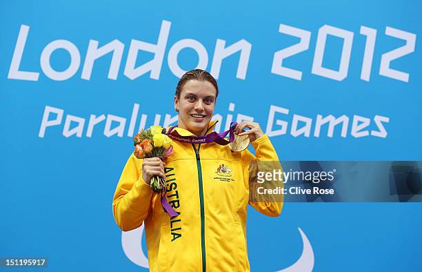 Gold medallist Jacqueline Freney of Australia poses on the podium during the medal ceremony for the Women's 100m Freestyle - S7 final on day 5 of the...