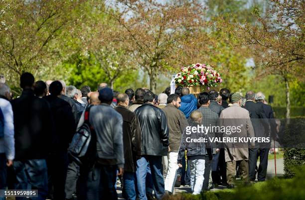 Relatives and friends of the 42-year-old Syrian origin man killed during a shooting at a shopping mall in Alphen aan den Rijn on april 9, carry the...