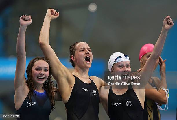 Maddison Elliot, Ellie Cole and Katherine Downie of Australia celebrate as teammate Jacqueline Freney wins them the gold medal in the Women's 4x100m...
