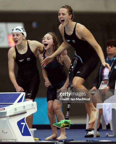 Maddison Elliot , Ellie Cole and Katherine Downie of Australia celebrate as team-mate Jacqueline Freney wins them the gold medal in the Women's...