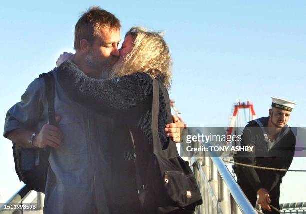 British rower Mike Noel-Smith gives his wife Elizabeth a kiss on the gangplank as they are reunited after his arrival on the NMAS Newcastle at the...