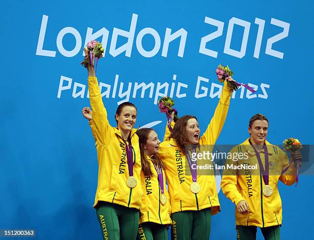Ellie Cole, Maddison Elliot, Katherine Downie and Jacqueline Freney of Australia pose on the podium during the medal ceremony for the Women's 4x100m...