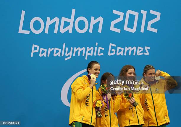 Ellie Cole, Maddison Elliot, Katherine Downie and Jacqueline Freney of Australia pose on the podium during the medal ceremony for the Women's 4x100m...