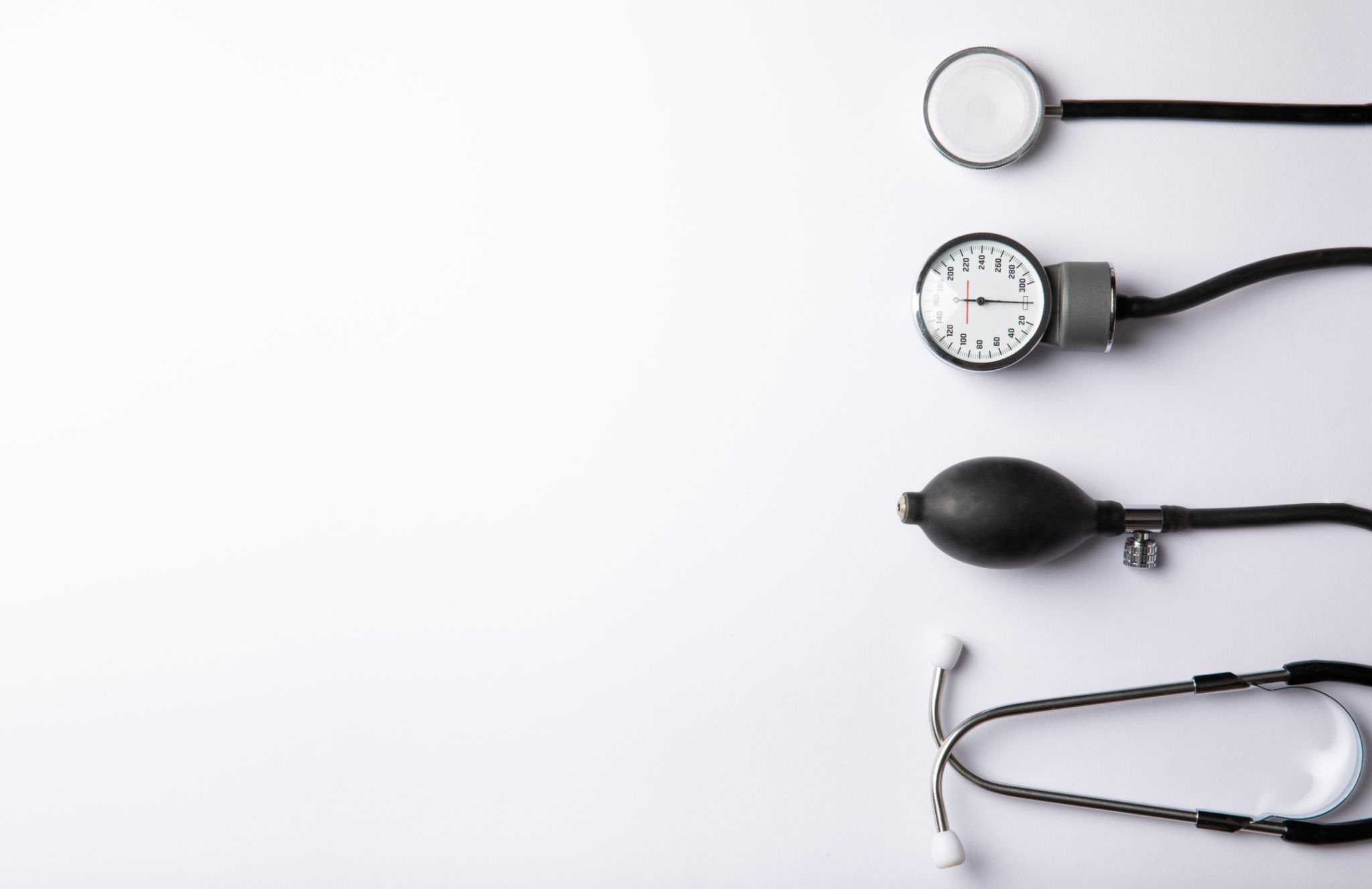 Black sphygmomanometer and medical equipment blood pressure monitor isolated on white background. Healthcare. Place for text. Medicine concept. The concept of cardiology. Black sphygmomanometer and medical equipment blood pressure monitor isolated on white background. Healthcare. Place for text. Medicine concept. The concept of cardiology.