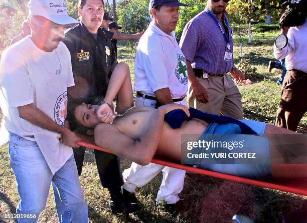 The member of the crew team of Venezuela, Miguel Vargas, which disappeared today in the morning, is taken 20 November 2002 by rescuers to the...