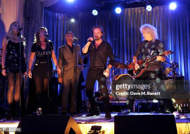 Alfie Boe and Brian May perform during the second annual "Freddie For A Day" event in memory of Queen's late frontman Freddie Mercury, at The Savoy...