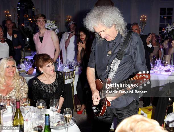 Anita Dobson and Brian May attend the second annual "Freddie For A Day" event in memory of Queen's late frontman Freddie Mercury, at The Savoy Hotel...