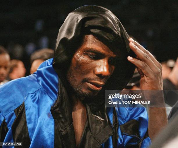 Hasim Rahman, who suffered a severe hematoma over his left eye from an accidental head-butt by Evander Holyfield, leaves the ring 01 June 2002 at...