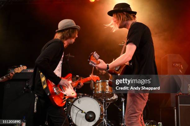 Aaron Lee Tasjan and Petter Ericson Stakee of the band Alberta Cross performs on stage during Reading Festival 2012 at Richfield Avenue on August 26,...