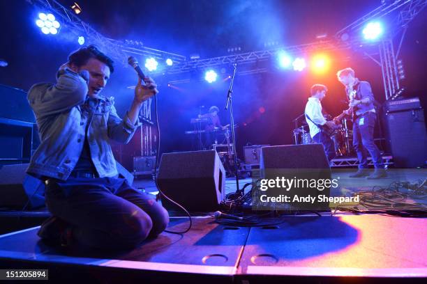 Will Daunt, Dom Millard, Henry Walton and Iain Lock of the band Zulu Winter perform on stage during Reading Festival 2012 at Richfield Avenue on...