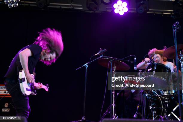 Shane Parsons and Simon Radley of the band DZ Deathrays perform on stage during Reading Festival 2012 at Richfield Avenue on August 26, 2012 in...