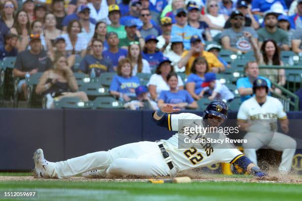 Christian Yelich of the Milwaukee Brewers scores during the eighth inning against the Chicago Cubs at American Family Field on July 03, 2023 in...