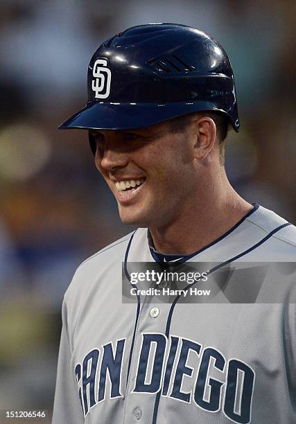 Clayton Richard of the San Diego Padres reacts after scoring a run for a 3-2 lead over the Los Angeles Dodgers off of a Chase Headley single during...