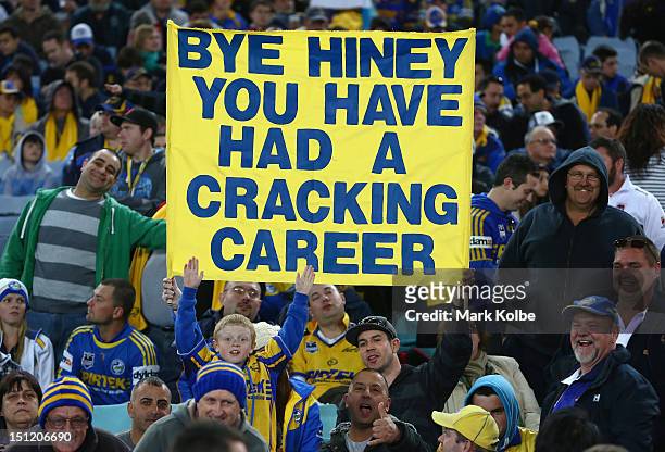 An Eels supporter in the crowd holds up a banner farewelling Nathan Hindmarsh during the round 26 NRL match between the Parramatta Eels and the St...