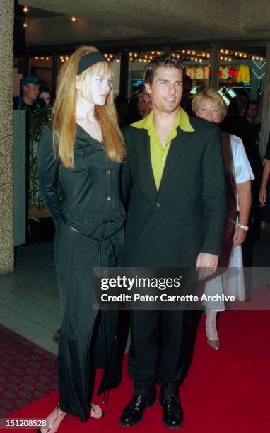 Actors Nicole Kidman and Tom Cruise arrive on the red carpet for the premiere of the film 'To Die For' on February 12, 1996 in Sydney, Australia.