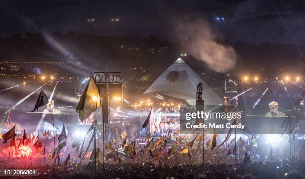 The crowd gathers to watch Elton John perform on the main Pyramid Stage on Day 5 of the Glastonbury Festival 2023 held at Worthy Farm, Pilton on June...