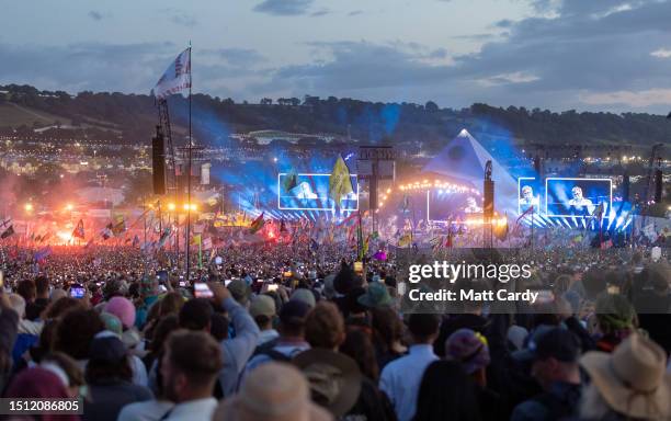 The crowd gathers to watch Elton John perform on the main Pyramid Stage on Day 5 of the Glastonbury Festival 2023 held at Worthy Farm, Pilton on June...