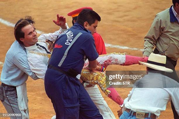 Bullfighter Juan Pablo Llaguno is carried from the arena after being injured by a bull named Copetes 07 May 2000 in Mexico City. El matador de Toros...