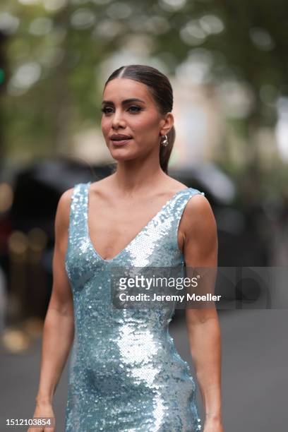 Camila Coelho is seen wearing a turquoise sequins dress, silver earrings and silver heels outside Tamara Ralph show during the Haute Couture...