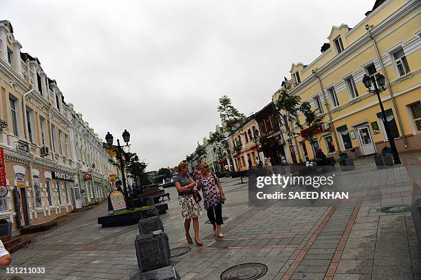 Residents walk in the old part of town prior to the Asia-Pacific Economic Cooperation in Vladivostok on September 4, 2012. APEC leaders' summit in...