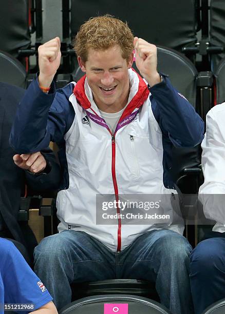 Prince Harry celebrates as Team GB scores as he attends the Goalball on day 6 of the London 2012 Paralympic Games at The Copper Box on September 4,...