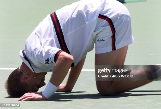 Defending champion Petr Korda of the Czech Republic doubles over in pain after injuring his ankle during his match with Galo Blanco of Spain at the...
