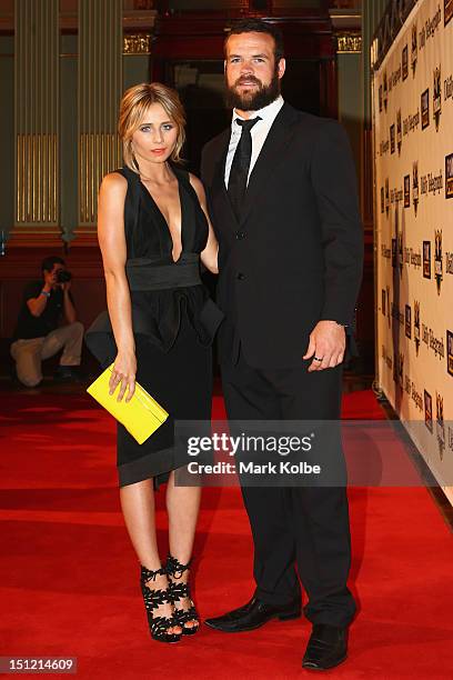 Tessa James and Nate Myles pose on the red carpet as they arrive for the 2012 NRL Dally M Awards at Sydney Town Hall on September 4, 2012 in Sydney,...