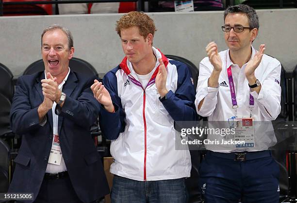 Prince Harry celebrates as Team GB scores as he attends the Goalball with British Paralympic Association chief executive Tim Hollingsworth on day 6...