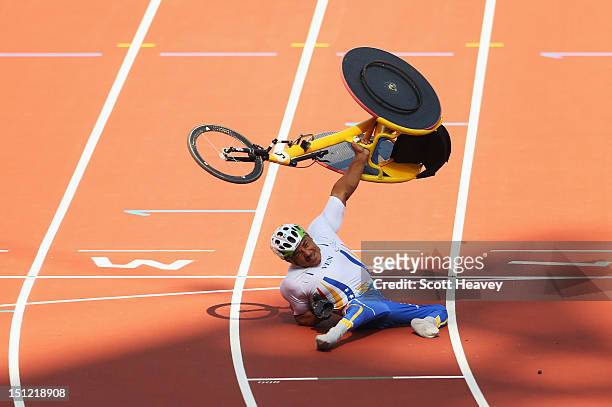 Jesus Aguilar of Venezuela crashes as he goes over the line to finish in the Men's 800m - T53 heats on day 6 of the London 2012 Paralympic Games at...