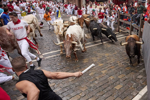 People take part in the traditionancierro' of the San Fermin Festival in Pamplona, Spain on July 07, 2023. The bull-running fiesta is held...
