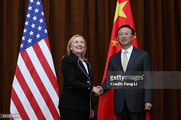 Secretary of State Hillary Clinton and Chinese Foreign Minister Yang Jiechi shake hands during her visit to Beijing on September 4, 2012.