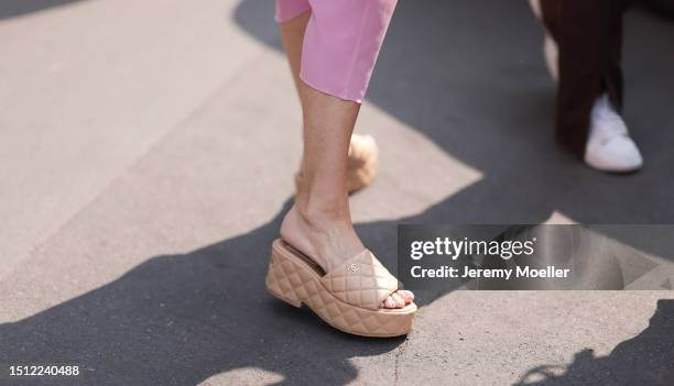 Fashion Week guest is seen wearing beige platform sandals in quilted leather from Chanel outside during the Thom Browne Show Haute Couture...