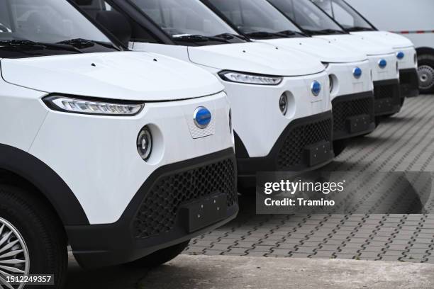 white electric delivery vans cenntro - fleet white vans stock pictures, royalty-free photos & images
