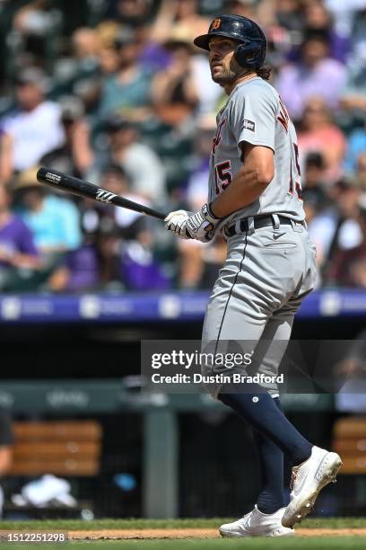 Jake Marisnick of the Detroit Tigers follows the flight of the ball after hitting an eighth inning grand slam homerun in a game against the Colorado...