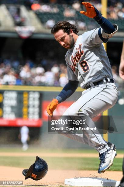 Matt Vierling of the Detroit Tigers slides safely to third base after hitting an eighth inning triple in a game against the Colorado Rockies at Coors...