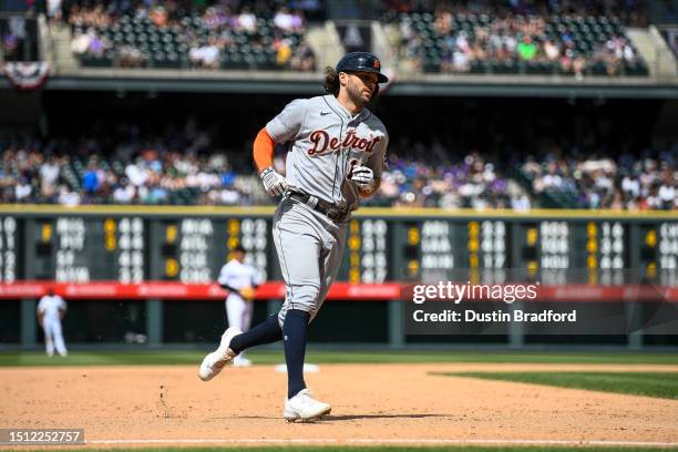 Jake Marisnick of the Detroit Tigers rounds the bases after hitting an eighth inning grand slam homerun in a game against the Colorado Rockies at...