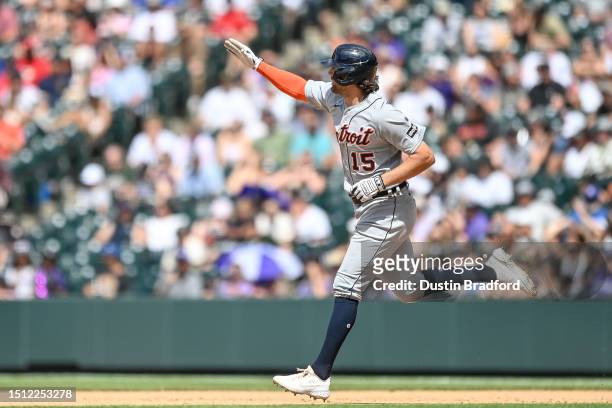 Jake Marisnick of the Detroit Tigers celebrates as he rounds the bases after hitting an eighth inning grand slam homerun in a game against the...