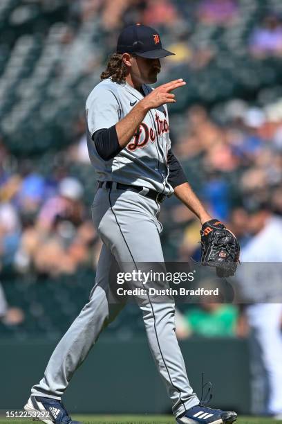 Jason Foley of the Detroit Tigers walks to shake hands with the catcher after completing the ninth inning of a win against the Colorado Rockies at...