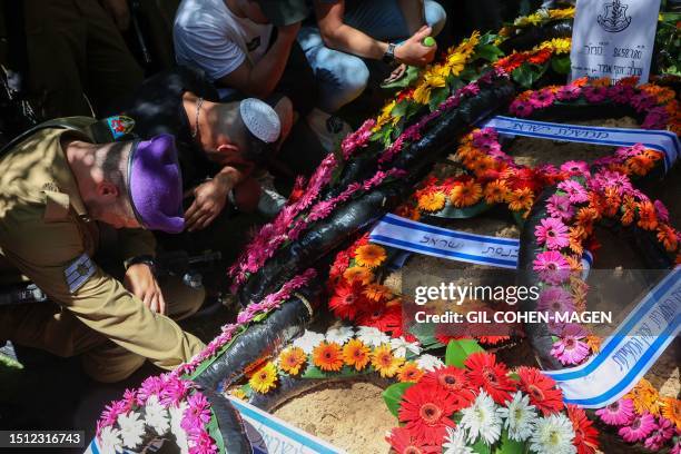 Israeli soldiers attend the funeral of a fellow soldier, killed the day before near Kedumim settlement, at the Mount Herzl cemetery in Jerusalem, on...
