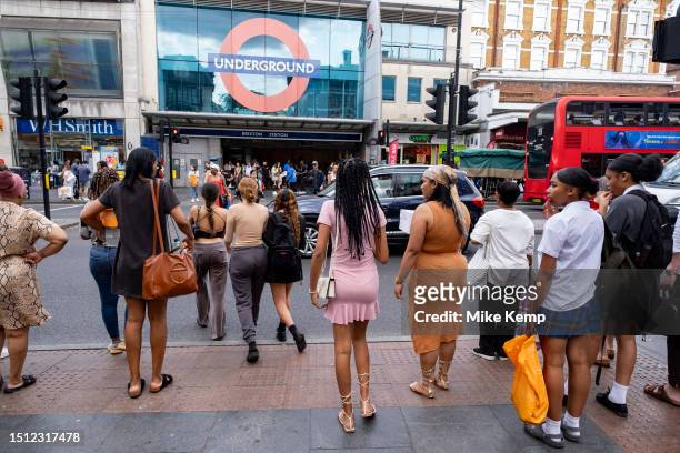 Street scene as people cross the road to and from Brixton underground station in the diverse community of Brixton on 22nd June 2023 in London, United...