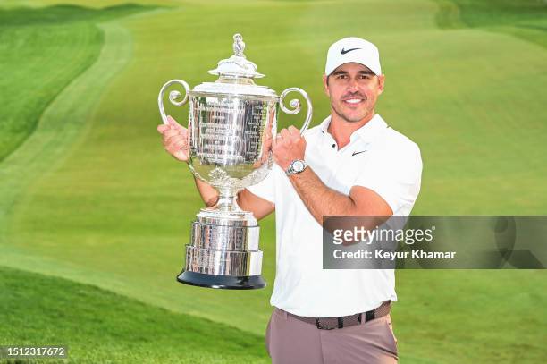 Brooks Koepka smiles with the Wanamaker Trophy following his two stroke victory in the final round of the 2023 PGA Championship at Oak Hill Country...