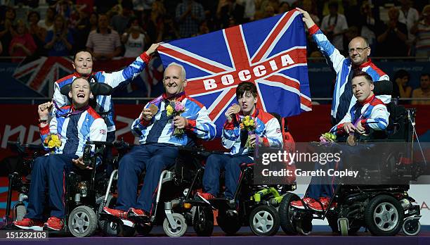 Daniel Bentley, Nigel Murray and Zoe Robinson and David Smith of Great Britain celebrate winning bronze in the Mixed Team Boccia - BC1-2 on day 6 of...