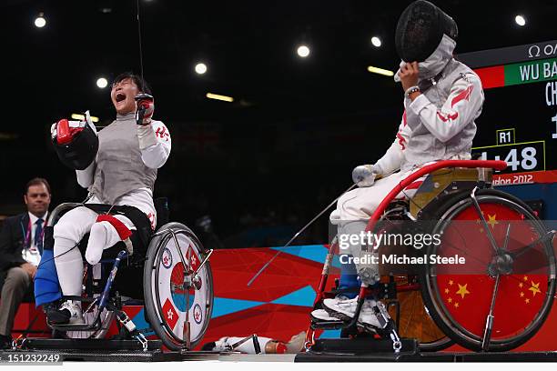 Chui Yee Yu of Hong Kong China celebrates winning gold against Baili Wu of China during the Women's Individual Foil Category A Final of the...