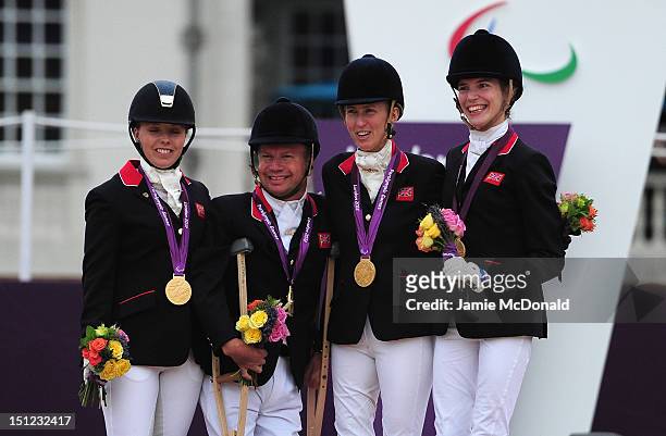 Sophie Wells, Lee Pearson, Deborah Criddle and Sophie Christiansen of Great Britain win Team Gold during the Equestrian Event on day 6 of the London...