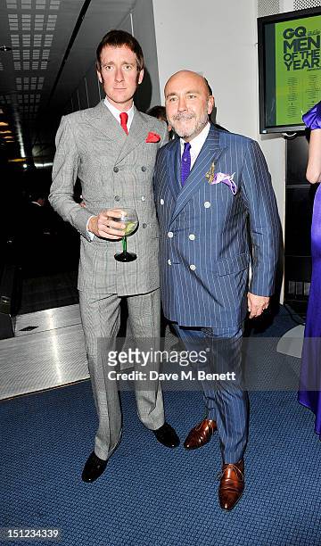 Bradley Wiggins and Mark Powell arrive at the GQ Men Of The Year Awards 2012 at The Royal Opera House on September 4, 2012 in London, England.